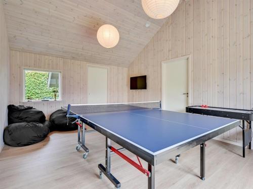 a ping pong room with a ping pong table at Holiday Home Regni - 300m to the inlet by Interhome in Nykøbing Mors