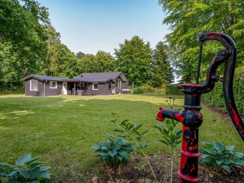 a garden hose in front of a house at Holiday Home Sunja - 450m from the sea by Interhome in Brøndstrup