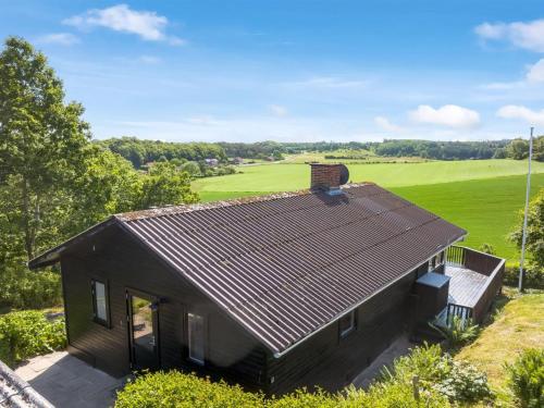 an overhead view of a small house with a green field at Holiday Home Imgert - 300m to the inlet by Interhome in Løgstrup