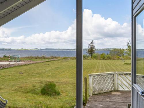a view of the water from the porch of a house at Holiday Home Arleta - 250m to the inlet by Interhome in Skals