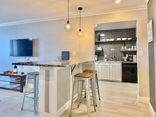 a kitchen with a large island in the middle of a room at Downtown! Free Onsite Parking! City View! LM1706 in Atlanta