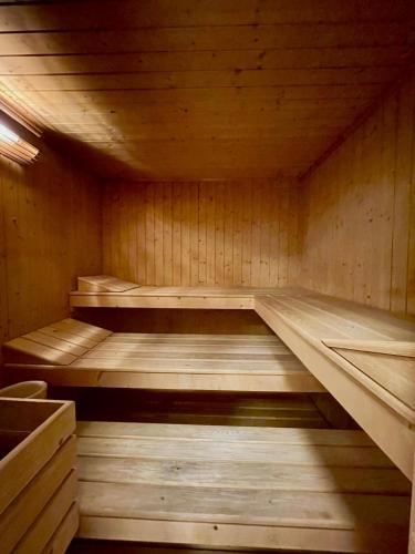 an empty wooden sauna with wooden floors and ceilings at Corte Uccellanda Relais & Spa in Monzambano