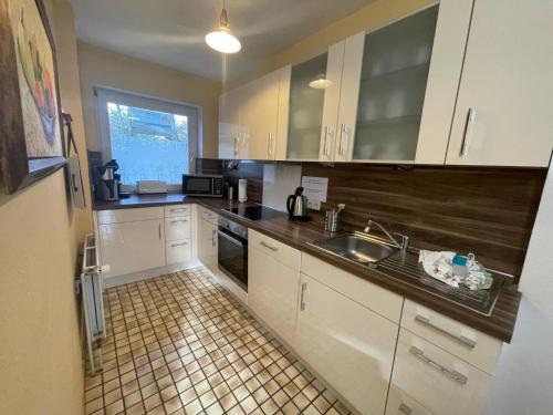 Kuchyň nebo kuchyňský kout v ubytování Ferienhaus Sylt Tinnum
