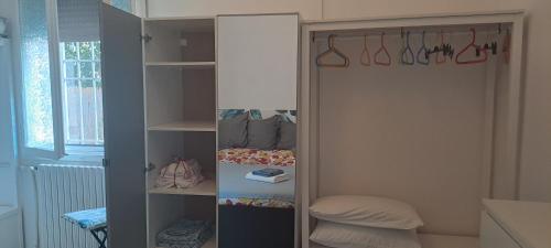 a room with a closet with shelves at Il Giardino Home in Lippo di Calderara di Reno