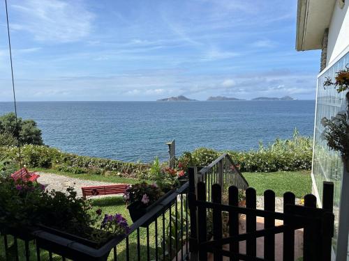 a view of the ocean from a house at Alojamiento peregrinos al pie del camino in Vigo