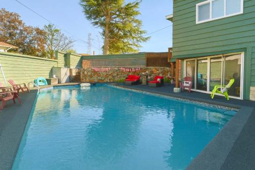 a swimming pool in the backyard of a house at Hidden Oasis in Victoria, BC in Victoria