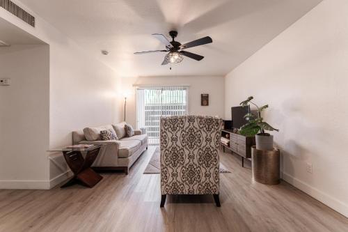 a living room with a couch and a ceiling fan at Central PHX Deluxe 1 BR King Bed & Patio w Pool in Phoenix