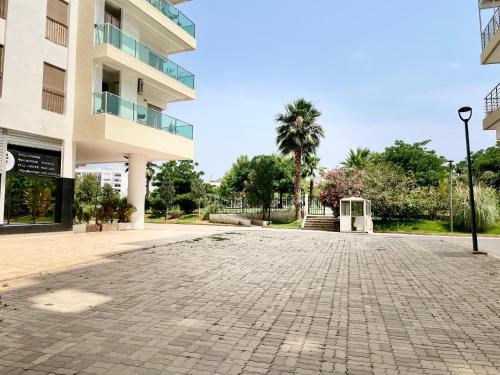 an empty parking lot in front of a building at Prestigia luxury appartement in Fès