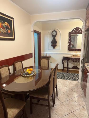 a dining room with a table and chairs at Central apartment Zemun in Zemun