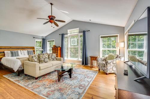 a living room with a couch and a table at 30 Acres and Pond North Georgia Mtn Farmhouse in Demorest