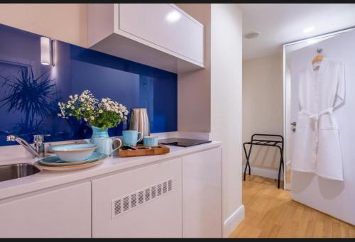 a kitchen with a sink and a counter top at ORBI CITY LUXURY deluxe KIG DVD in Batumi