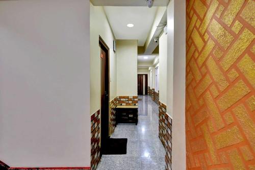 a corridor of a building with a hallway at Hotel O Parasol Inn Gangtok in Gangtok