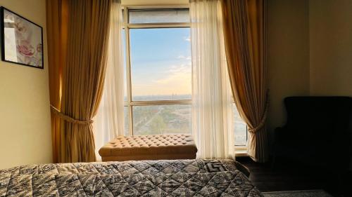 Кровать или кровати в номере Montressa High Rise Apartments Facing Centaurus Mall Islamabad