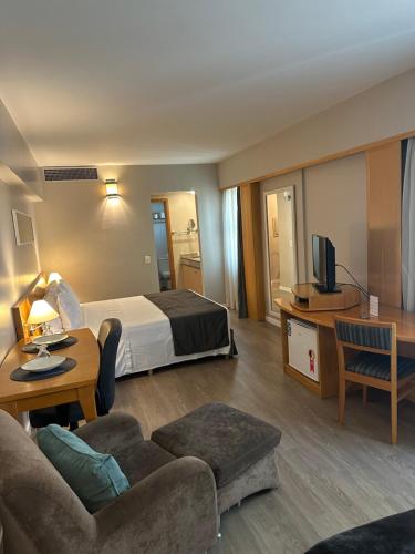 Postel nebo postele na pokoji v ubytování Hotel & Residence Alphaville