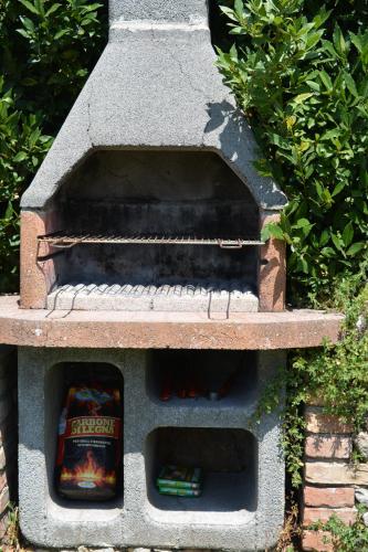 a stone bird house with two books in it at Borgo dé Brandi in Monteriggioni
