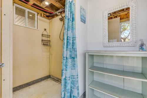 a bathroom with a mirror and a shower at Banana Pancakes in Oak Island