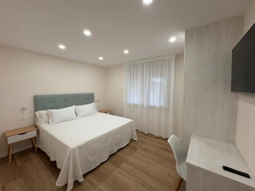 Ένα ή περισσότερα κρεβάτια σε δωμάτιο στο Adina Garden Sanxenxo