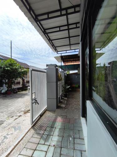 a door to a building with a view of a street at LA LUNA Guest House in Banyuwangi