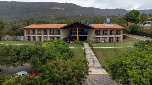 an aerial view of a building with a house at Pasargada Hotel in Crato