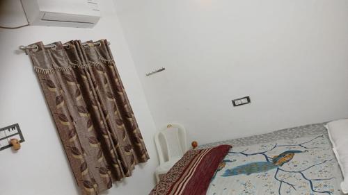 Katil atau katil-katil dalam bilik di Param Homestay