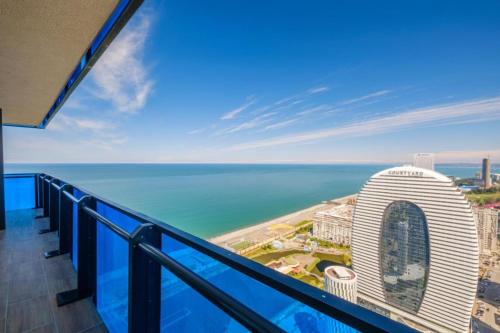 a view of the ocean from the balcony of a building at Picturesque Sea View Aparthotel In Orbi City Batumi in Batumi