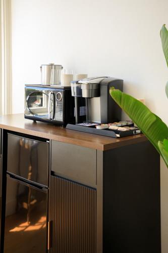 a microwave sitting on top of a kitchen counter at The Historic Schoolhouse Inn in Trinidad