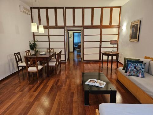 a living room with a couch and a table at HISTORIC TOWN HOUSE Apartment in Ljubljana