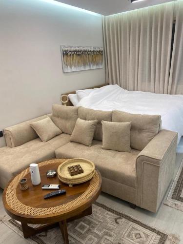 a living room with a couch and a bed at سندباد in Riyadh
