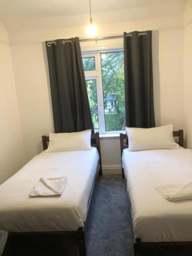 Ένα ή περισσότερα κρεβάτια σε δωμάτιο στο Abbeyfield Guesthouse