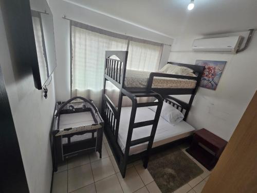 Кровать или кровати в номере Casa Los Higos Malaga Condominios