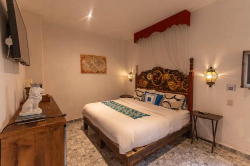 Ένα ή περισσότερα κρεβάτια σε δωμάτιο στο Hotel Villa Peñasco