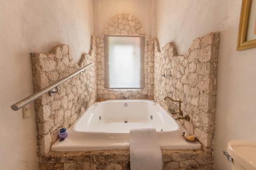 Ένα μπάνιο στο Hotel Villa Peñasco
