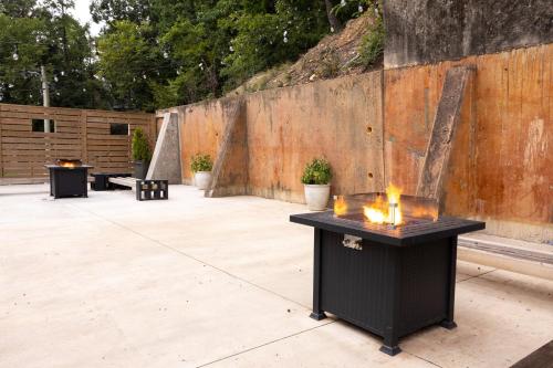 a patio with a black table with candles on it at Steps to Bathhouses, Historic Studio, KING BED, Room # 101 in Hot Springs