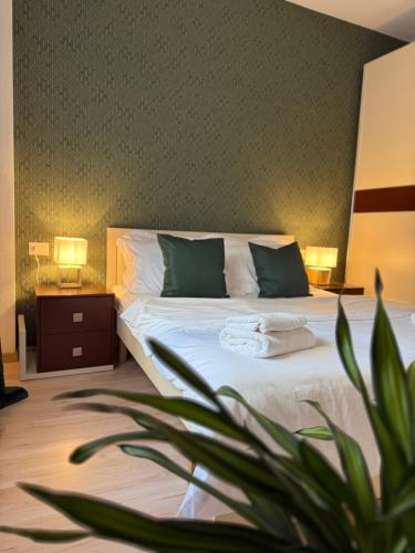 Postel nebo postele na pokoji v ubytování N&N City Nest Apartment