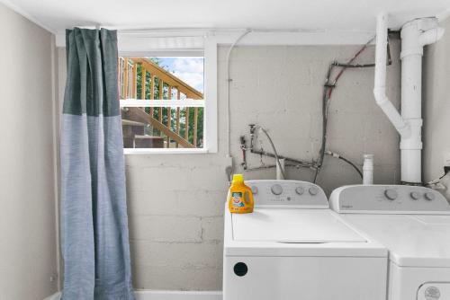 a kitchen with a washing machine and a window at Dugan Ave Unit B in Owenton