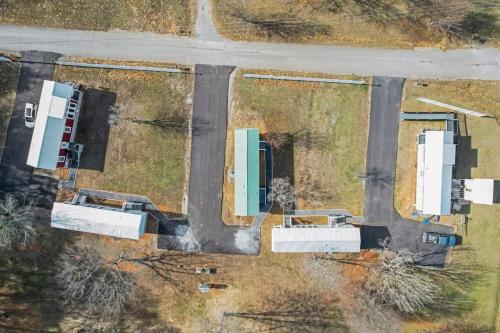 an aerial view of a parking lot with two white buildings at Byrd 6 Cozy Byrd Nest in Owens Cross Roads