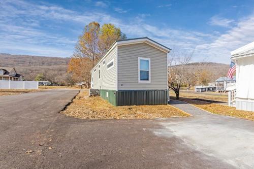 a small house sitting on the side of a road at Byrd 6 Cozy Byrd Nest in Owens Cross Roads