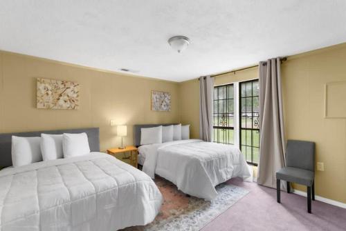 Ένα ή περισσότερα κρεβάτια σε δωμάτιο στο Terrace G Cozy Ranch