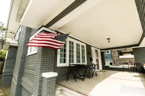 an american flag on the side of a house at 29th Street Trendy Lakeview Craftsman 8 in Birmingham