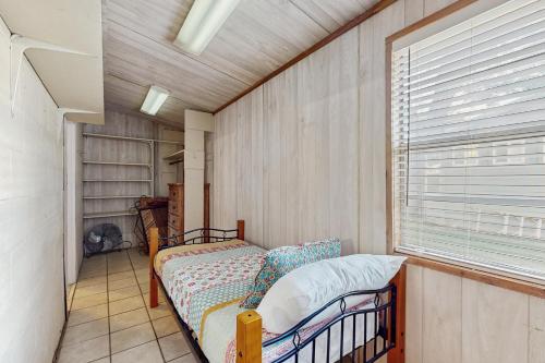 a bedroom with two bunk beds and a window at Sunny Days Lake Retreat - Main house in Kingsland