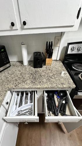 a kitchen with a counter top with a stove and a counter top at 12th Ave The Bricks - Unit 5 in Birmingham