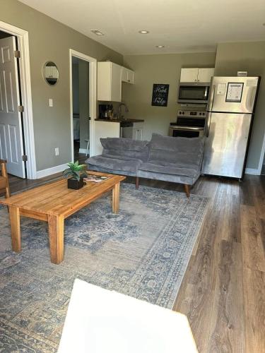 a living room with a couch and a table at Bethany B Huntsville Oasis in Rideout Village