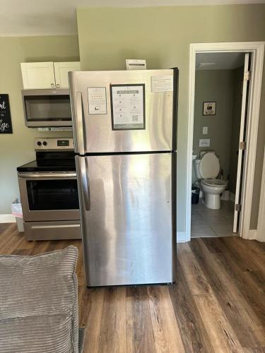 a stainless steel refrigerator in a kitchen at Bethany B Huntsville Oasis in Rideout Village