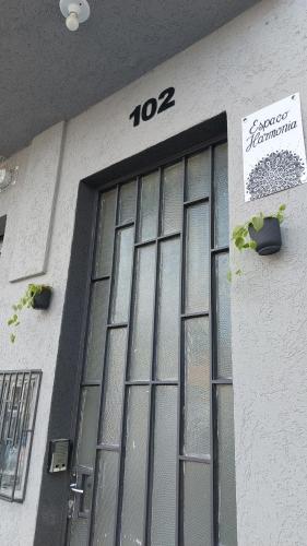 a building with a door with the number on it at Espaço Harmonia - um apartamento inteiro e aconchegante para vc! in Curitiba