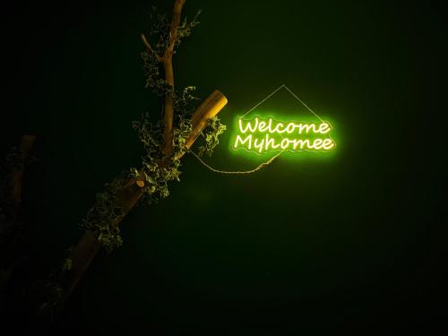 a neon sign that says welcome to a museum at Tropical studio - myHomee in Xanthi