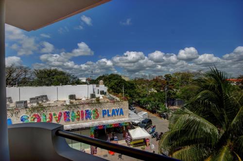 a view from a balcony of a amusement park at Palmar del Sol by Riviera Maya Suites in Playa del Carmen