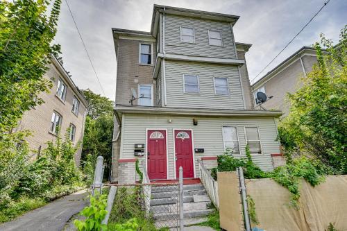 an old house with a red door on a street at Convenient Hartford Condo Less Than 2 Mi to Dtwn! in Stowe Village Housing Project