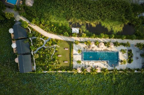 an aerial view of a resort with a swimming pool at Cháy Mountain Retreat Ninh Bình in Ninh Binh