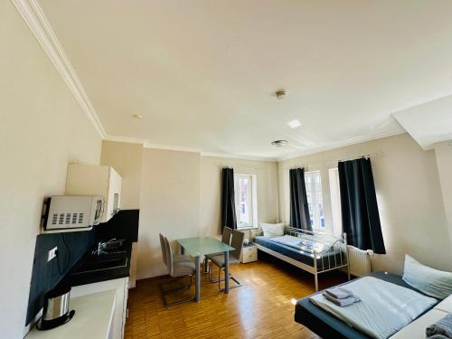 a living room with a couch and a table at Apartmenthouse Singen in Singen