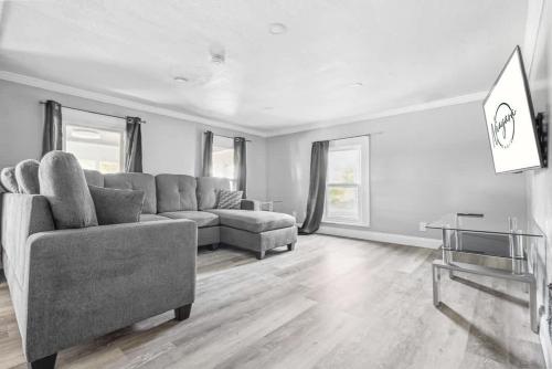 a living room with a couch and a table at Spacious 3BR 1BA close to the Falls in Niagara Falls